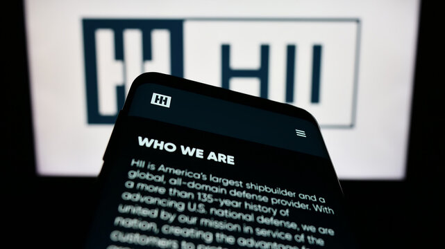 Stuttgart, Germany - 07-02-2023: Mobile phone with website of US shipbuilding company HII Corporate on screen in front of business logo. Focus on top-left of phone display.