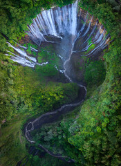 Aerial top view from above of Tumpak Sewu ,also known as Coban Sewu, 120m high waterfall in Malang regency, East Java, Indonesia - 622990369