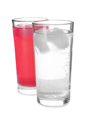 Glasses of different refreshing soda water with ice cubes on white background