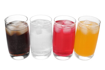 Glasses of different refreshing soda water with ice cubes on white background