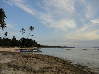 Beautiful White Sand Beach Located in North Maluku, Indonesia. Beautiful Scenery of Blue Sky, Ocean and White Sand Beach.