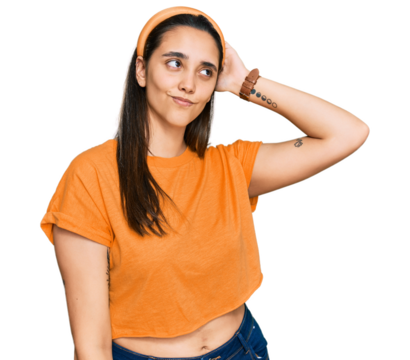 Young hispanic woman wearing casual clothes confuse and wondering about question. uncertain with doubt, thinking with hand on head. pensive concept.