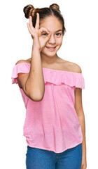 Beautiful brunette little girl wearing summer pink shirt smiling happy doing ok sign with hand on eye looking through fingers