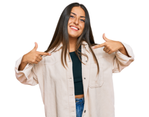 Beautiful hispanic woman wearing casual clothes looking confident with smile on face, pointing oneself with fingers proud and happy.