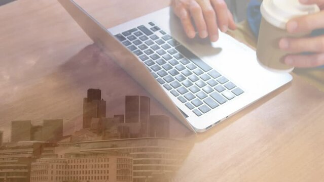Animation of caucasian businessman with laptop over cityscape