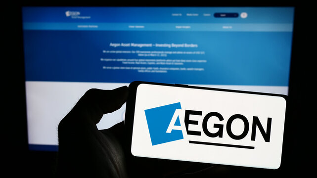Stuttgart, Germany - 07-04-2023: Person holding mobile phone with logo of Dutch financial services company Aegon N.V. on screen in front of web page. Focus on phone display.