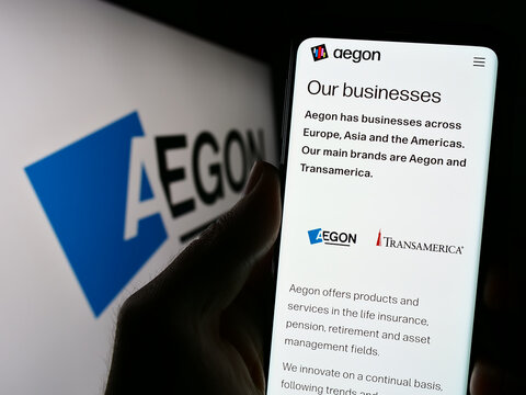 Stuttgart, Germany - 07-04-2023: Person holding cellphone with website of Dutch financial services company Aegon N.V. on screen in front of logo. Focus on center of phone display.