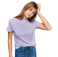 Fototapeta premium Teenager caucasian girl wearing casual clothes confuse and wonder about question. uncertain with doubt, thinking with hand on head. pensive concept.