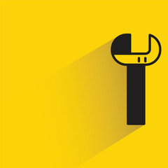 wrench with shadow on yellow background