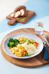 fried eggs with bacon and vegetables