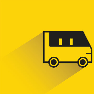 van with shadow on yellow background