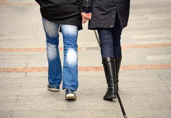 Geneva, Switzerland, Europe - couple walking street hand in hand, rear view