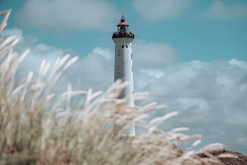 Lighthouse and dune with grass