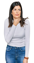 Beautiful brunette woman wearing casual clothes touching painful neck, sore throat for flu, clod and infection