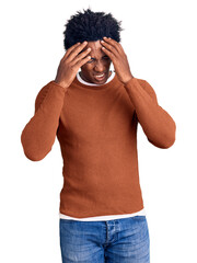 Fototapeta premium Handsome african american man with afro hair wearing casual clothes with hand on head for pain in head because stress. suffering migraine.