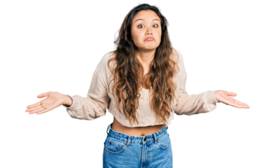 Young hispanic girl wearing casual clothes clueless and confused with open arms, no idea and doubtful face.