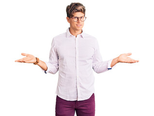 Young handsome man wearing business clothes and glasses clueless and confused with open arms, no...
