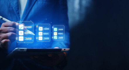 businessman uses technology to take online checklist survey Mark checklists and complete online forms. Question answer concept. Assessment. Online survey.
