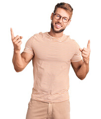 Fototapeta premium Young caucasian man wearing casual clothes and glasses smiling confident pointing with fingers to different directions. copy space for advertisement