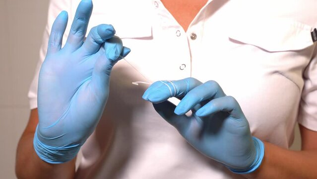 Close-up dentist hands in medical gloves flossing with floss tooth care hygiene, teeth cleaning routine and cavity prevention, female veneer smile, dental care and dentistry