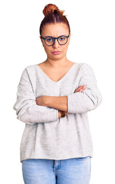 Young latin woman wearing casual clothes skeptic and nervous, disapproving expression on face with crossed arms. negative person.