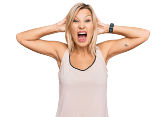 Middle age caucasian woman wearing casual clothes crazy and scared with hands on head, afraid and surprised of shock with open mouth