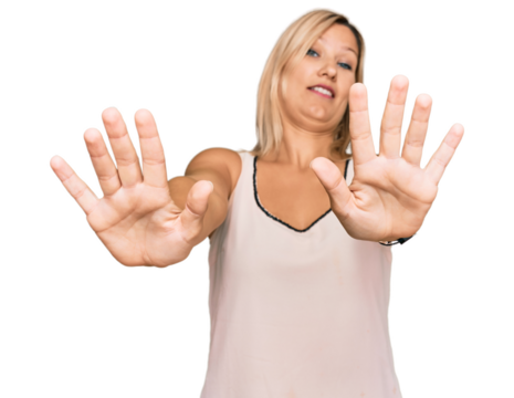 Middle age caucasian woman wearing casual clothes doing stop gesture with hands palms, angry and frustration expression - Powered by Adobe