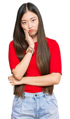 Young chinese woman wearing casual clothes thinking looking tired and bored with depression problems with crossed arms.