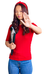 Young beautiful chinese girl wearing student folder with open hand doing stop sign with serious and confident expression, defense gesture