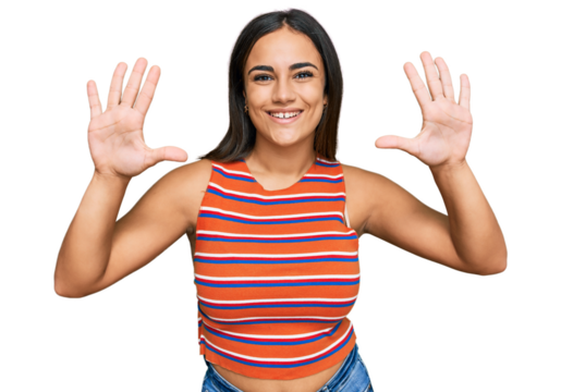 Young brunette woman wearing casual clothes showing and pointing up with fingers number ten while smiling confident and happy.