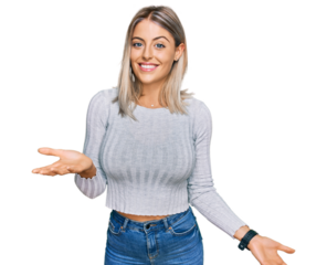 Beautiful blonde woman wearing casual clothes smiling cheerful with open arms as friendly welcome, positive and confident greetings