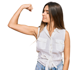 Young hispanic woman wearing casual clothes strong person showing arm muscle, confident and proud of power