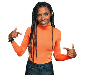 African american woman wearing casual clothes looking confident with smile on face, pointing oneself with fingers proud and happy.