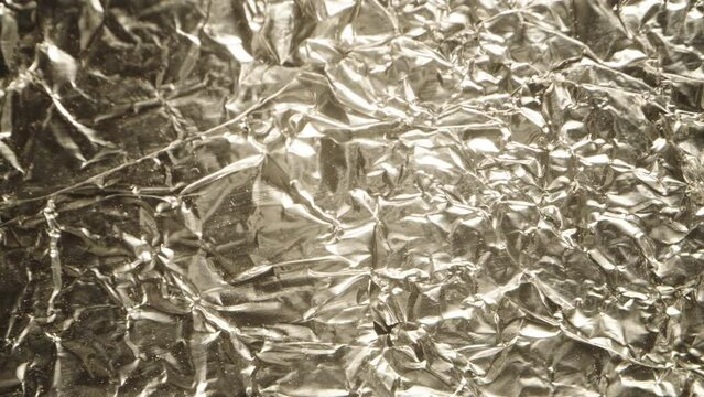 Texture of crumpled silver foil, macro slider.