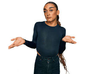 Hispanic transgender man wearing make up and long hair wearing casual clothes clueless and confused expression with arms and hands raised. doubt concept.
