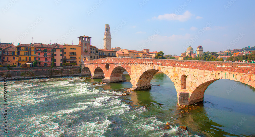 Wall mural panoramic view to bridge ponte pietra in verona on adige river, veneto region, italy.