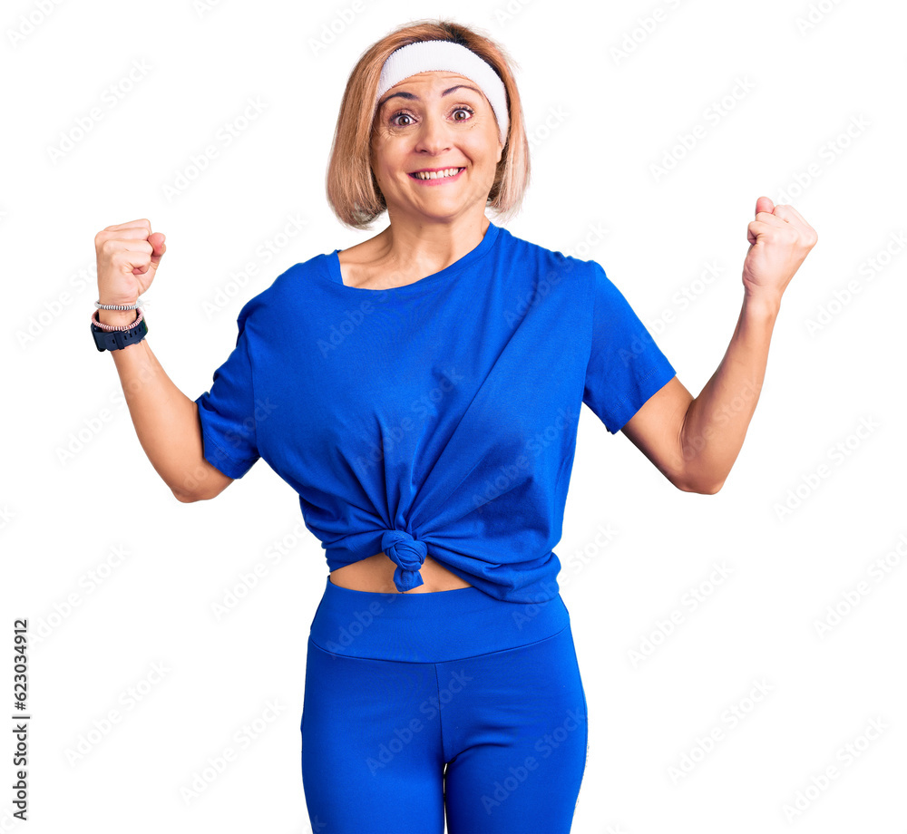 Sticker young blonde woman wearing sportswear celebrating surprised and amazed for success with arms raised 