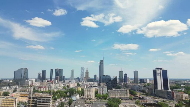 Aerial panorama of Warsaw, Poland over the Vistual river and City center in a distance. Downtown skyscrapers cityscape. Business