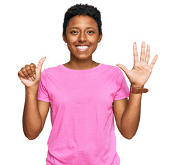 Young african american woman wearing casual clothes showing and pointing up with fingers number six while smiling confident and happy.