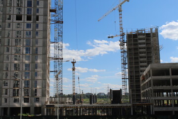Fototapeta na wymiar construction site with cranes/ 