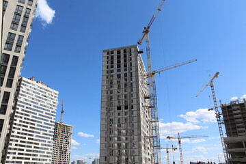 Fototapeta na wymiar construction site with cranes. crane on a background of blue sky. 