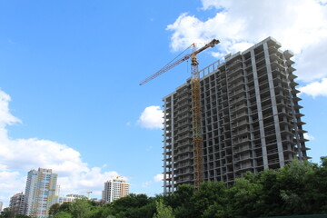 Obraz na płótnie Canvas crane in construction site. crane on the construction site.