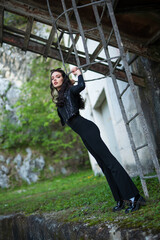 beautiful girl in black dress with long legs. selective focus