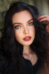 portrait of beautiful girl with light eyes and dark hair