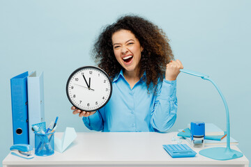 Young happy fun successful employee business woman wear casual shirt sit work at white office desk...