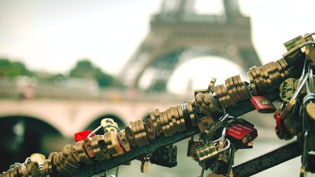 Many love locks or padlocks as love symbols at the Eiffel Tower, Paris