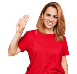 Hispanic young woman wearing casual red t shirt showing and pointing up with fingers number four while smiling confident and happy.