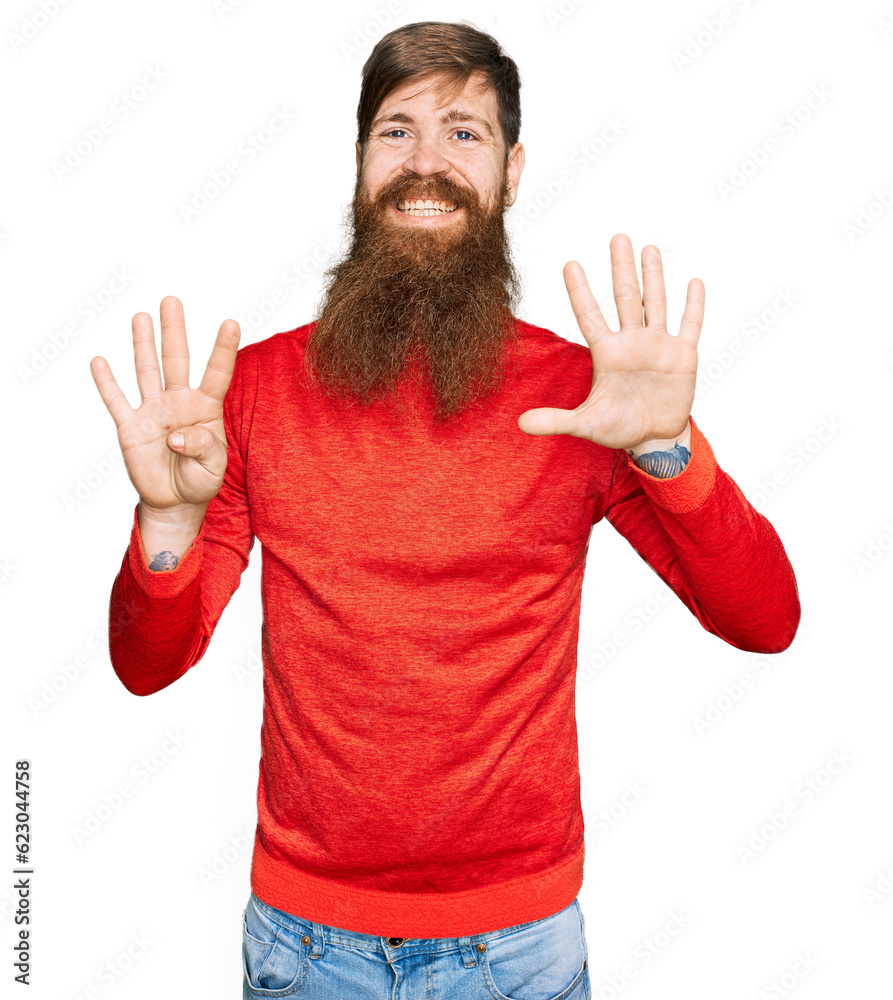 Wall mural redhead man with long beard wearing casual clothes showing and pointing up with fingers number nine 