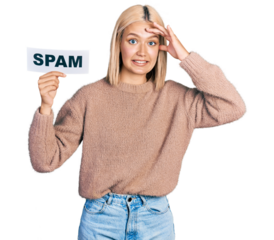 Beautiful young blonde woman holding spam banner stressed and frustrated with hand on head, surprised and angry face