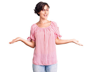 Beautiful young woman with short hair wearing casual summer clothes smiling showing both hands open palms, presenting and advertising comparison and balance